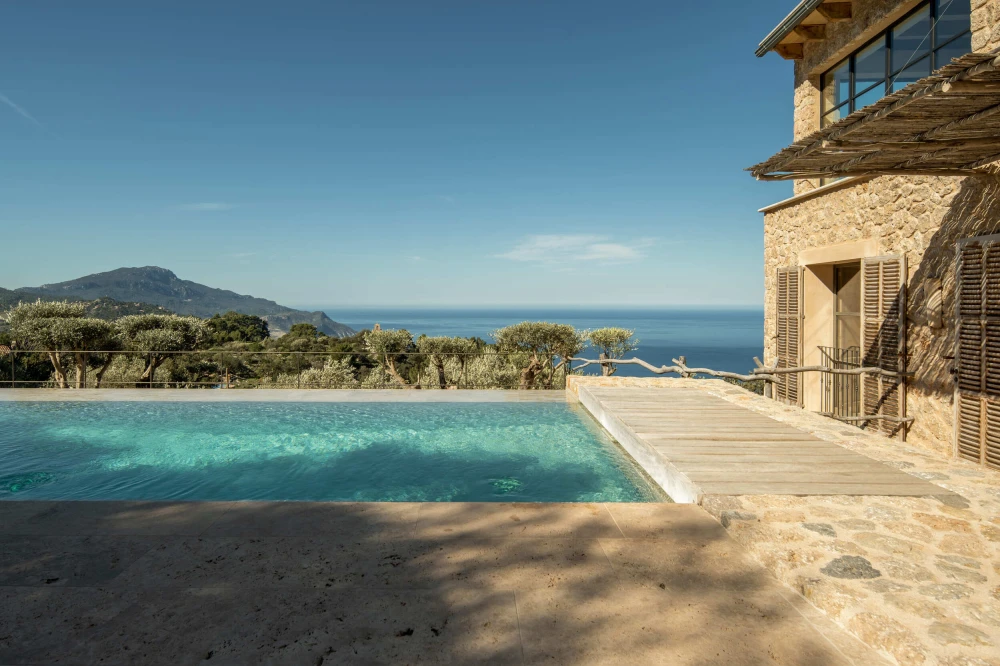 A photo of a Mallorca property showcasing its pool and views.