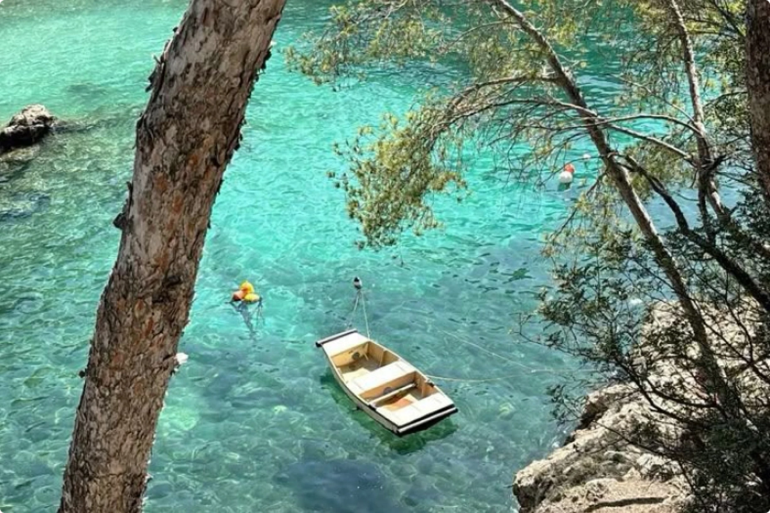 A rowing boat floating in the ocean. 