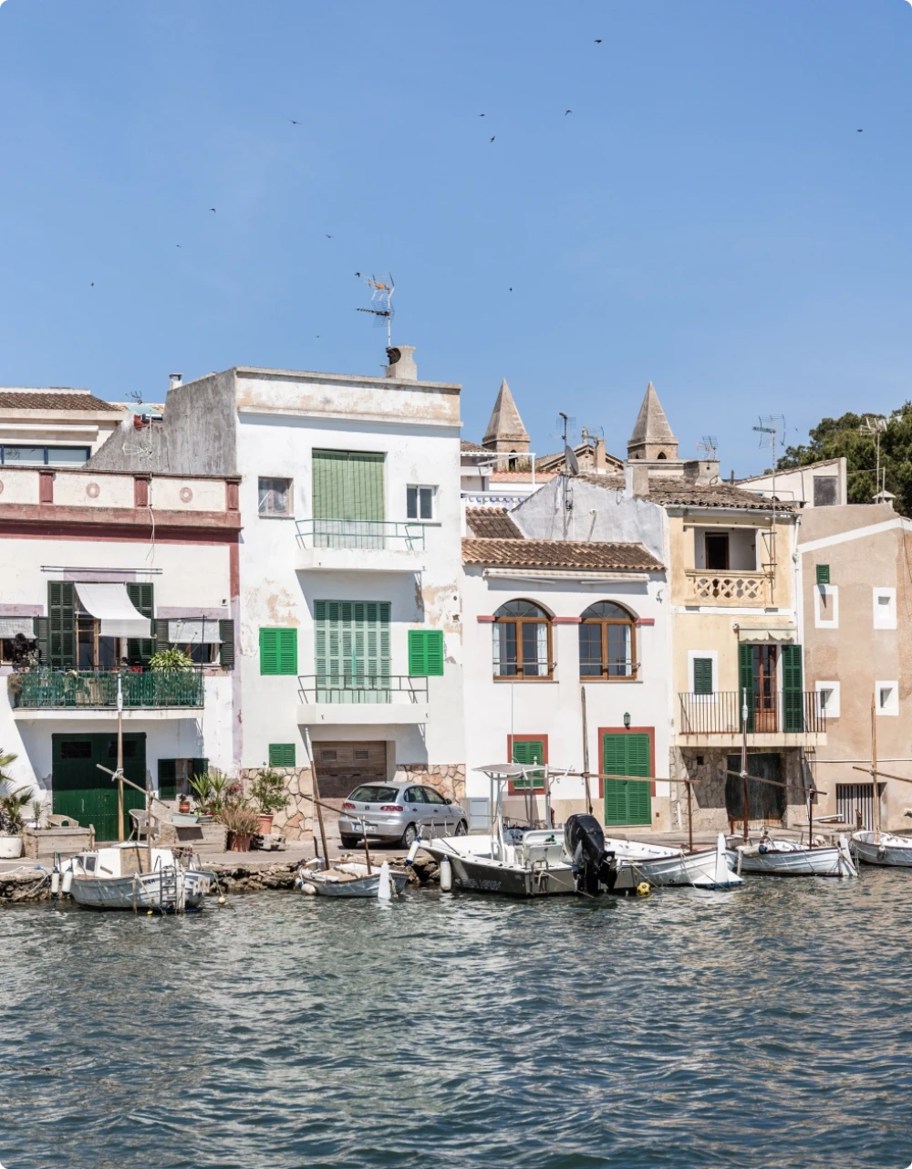 A white property positioned on the waterfront