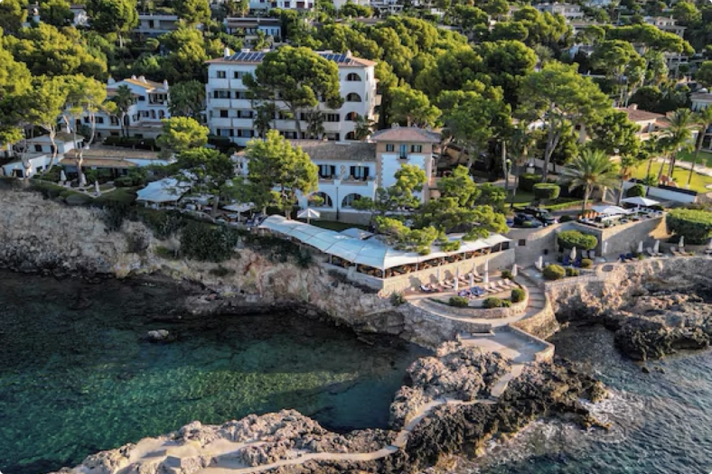 Aerial shot of a property positioned on a coastal cove