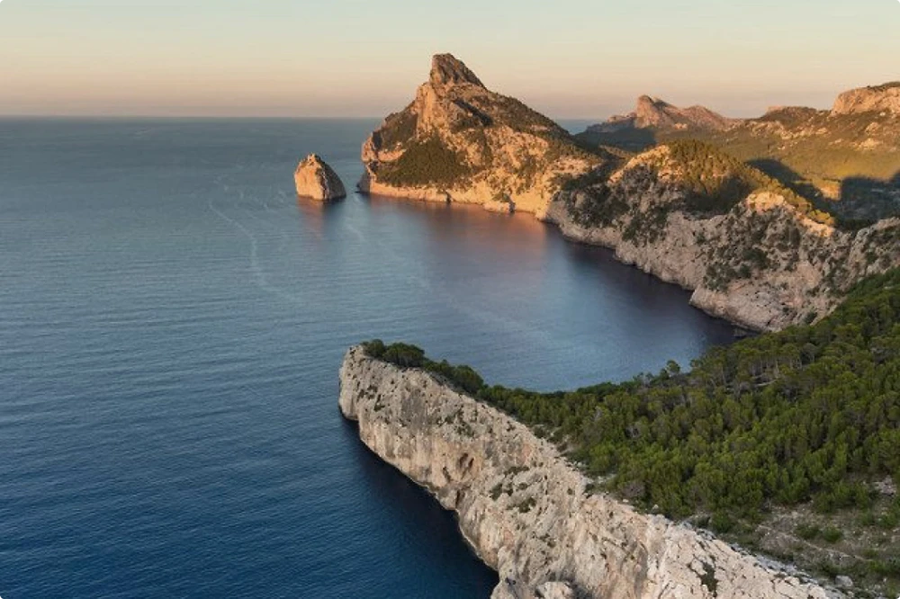 A coastal cove with a sunset