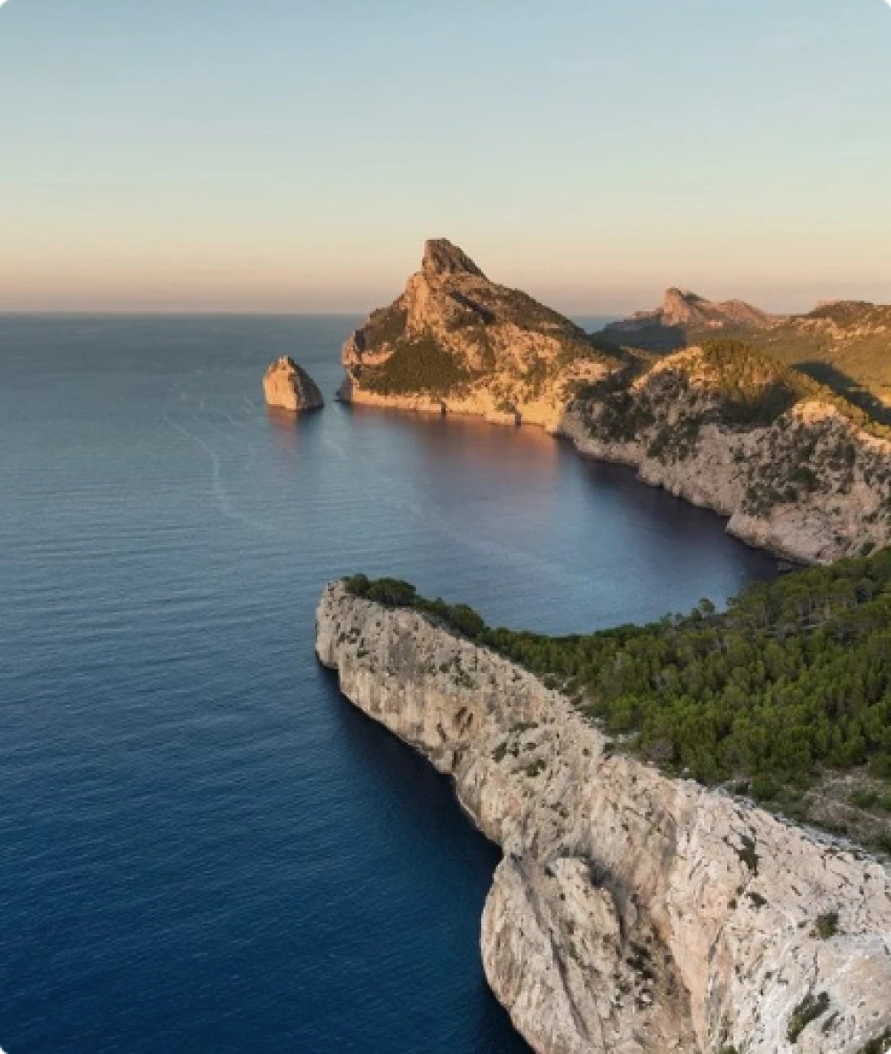 A coastal cove with a sunset