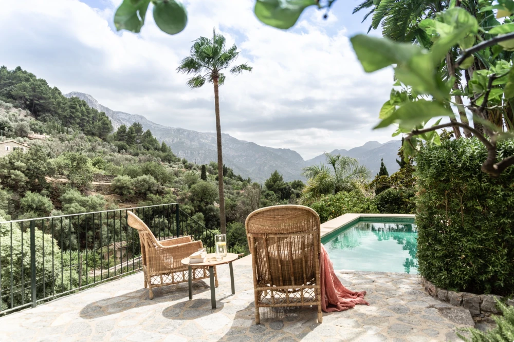 Two chairs near a poolside