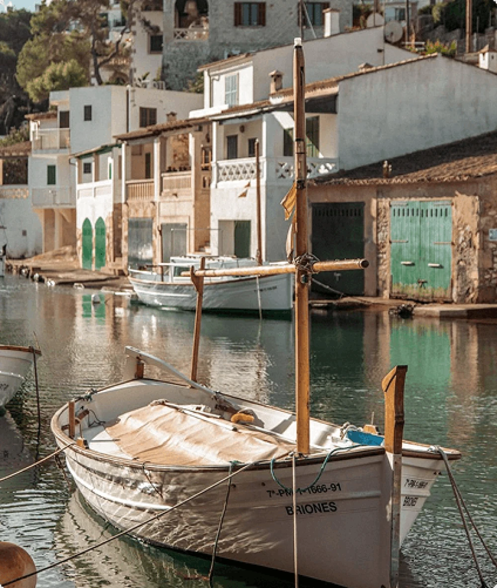 Traditional fishing boats moored in the picturesque inlet of Cala Figuera near Santanyí